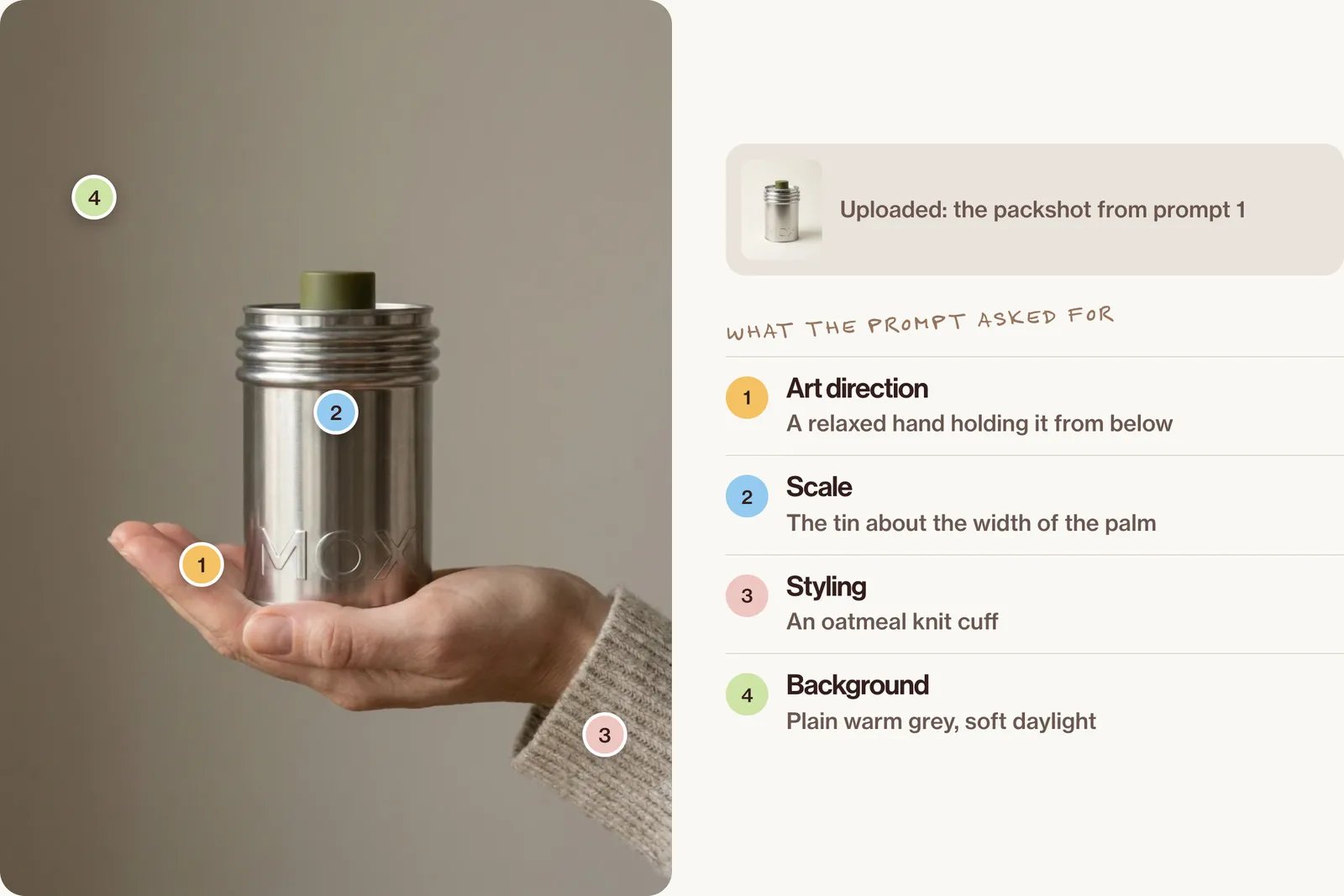 A hand in an oatmeal knit cuff holding the tin on its palm against a warm grey wall, with pins on the hand, the scale, the cuff and the background.