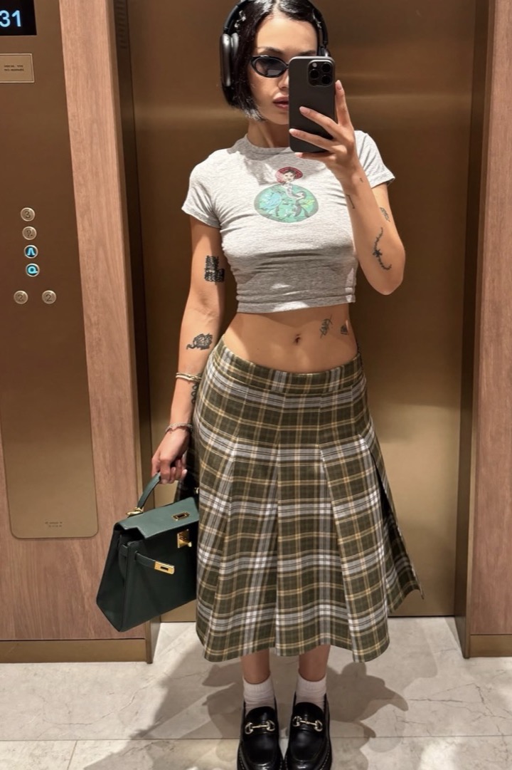 Creator mirror selfie in an elevator