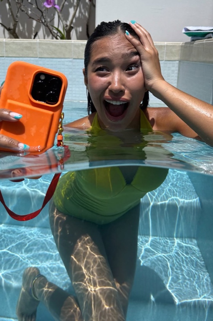 Creator taking a pool selfie